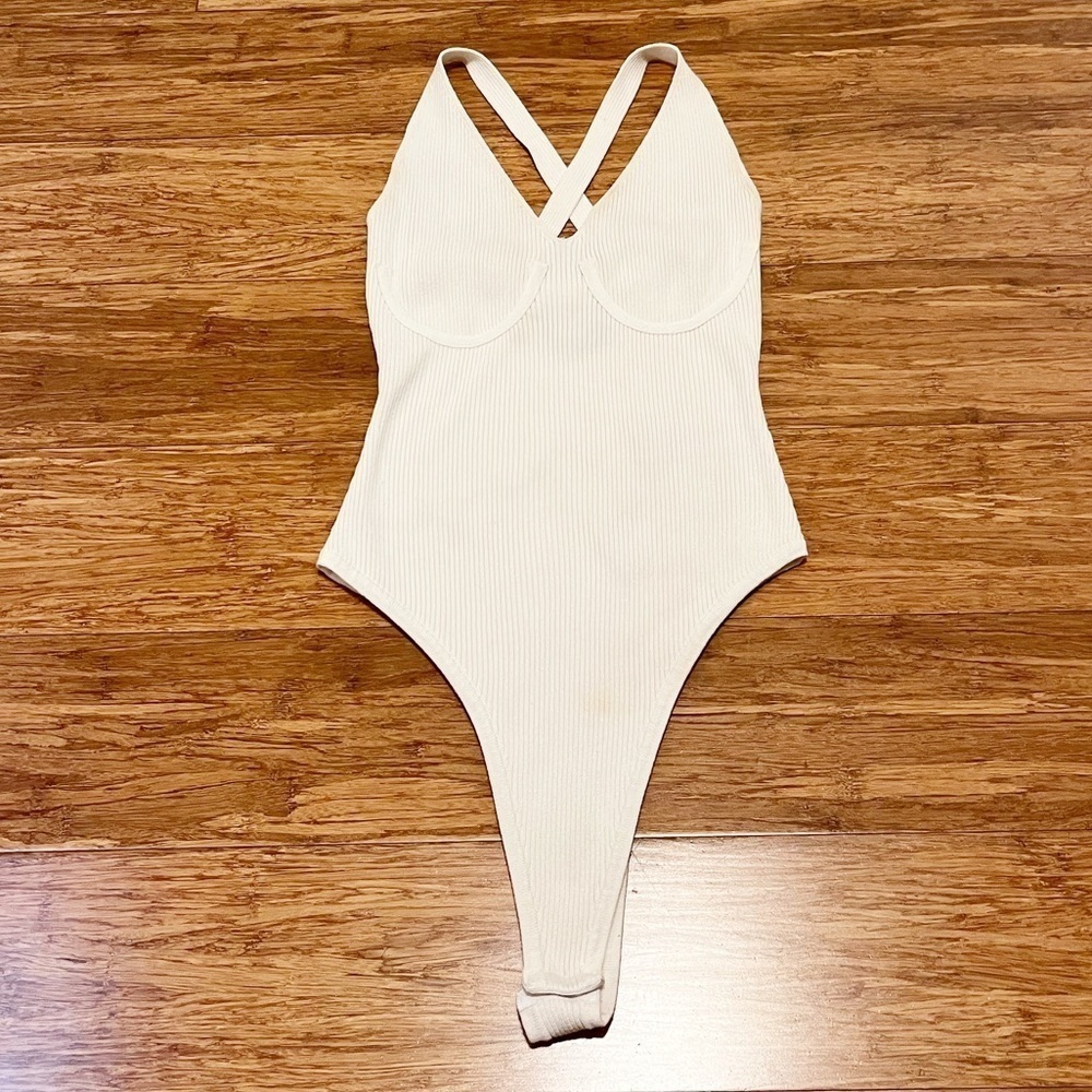 ASOS white ribbed french cut snap body suit w/ criss-cross back. Size 8